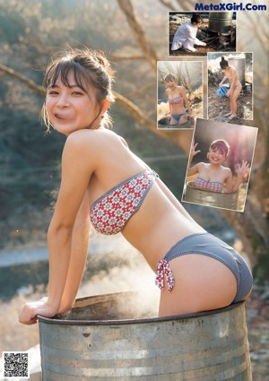 A woman in a pink kimono is taking a bath.
