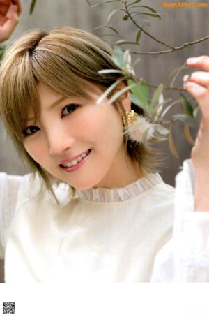 A woman in a blue kimono sitting on a magazine cover.