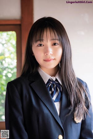 A magazine with a girl in a school uniform on the cover.